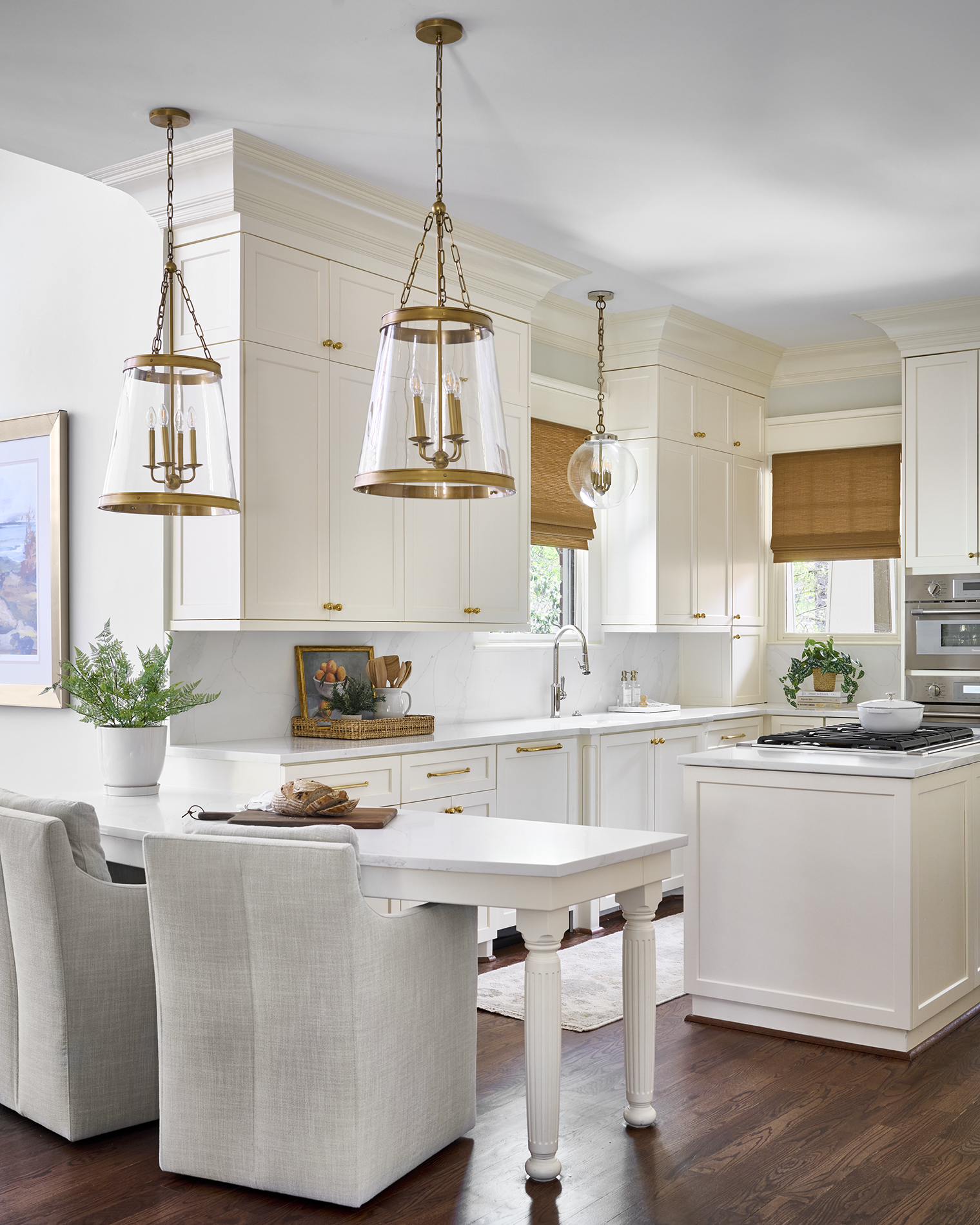 Photo of classic coastal craftsman kitchen showing the use of brass light fixtures and brass cabinet hardware by Atlanta Interior Designer in a Buckhead home.