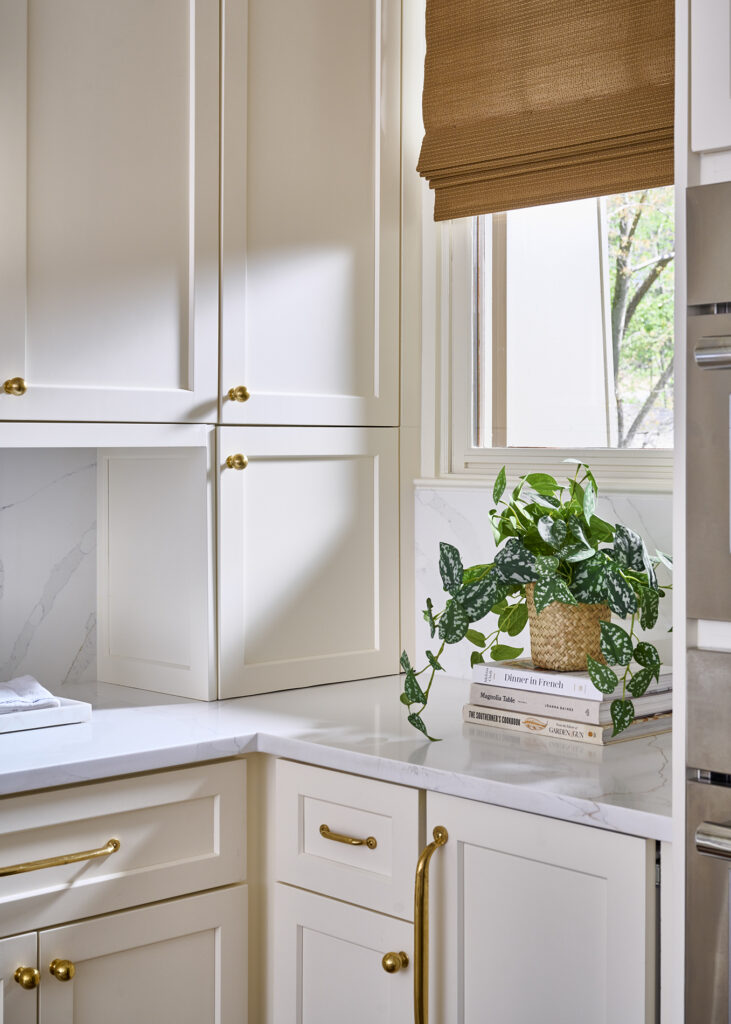 photo of classic coastal craftsman kitchen showing the use of brass cabinet hardware by an Atlanta interior designer in a Buckhead home.