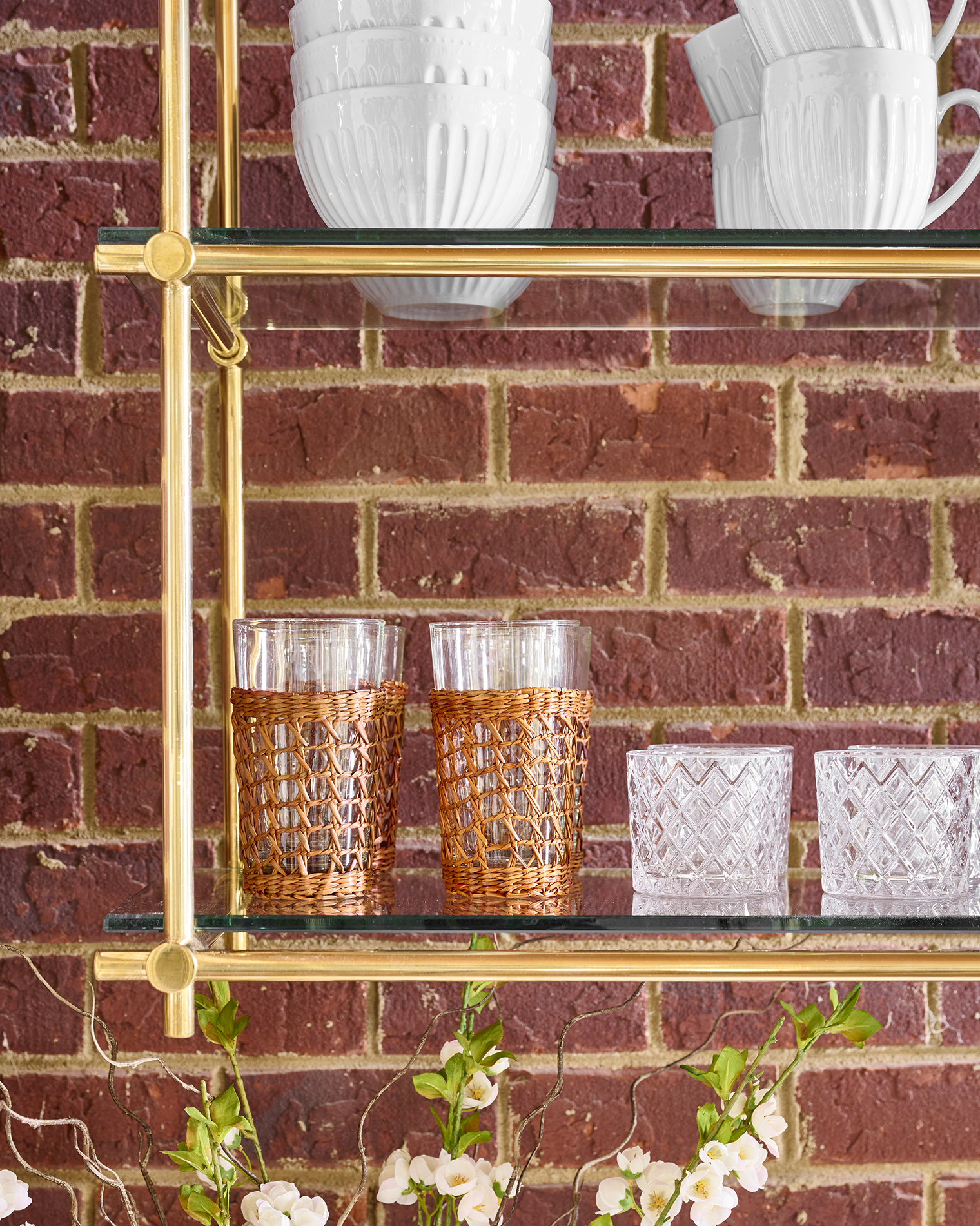 Traditional bar with brass open shelving shown as an example of interior design Brass Trend